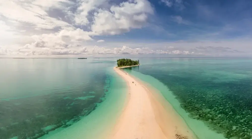 Pure white sand bridge that connects Morotai to North Maluku, pictured during the dry season, the overall best time to visit Indonesia