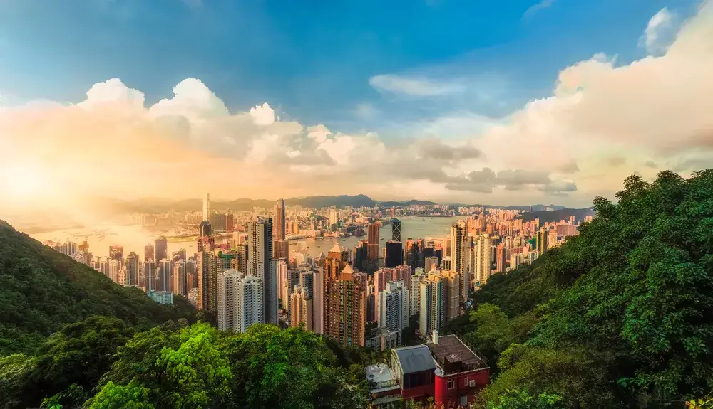 Sunset over Victoria Bay in Hong Kong depicting an overall safe city for tourists