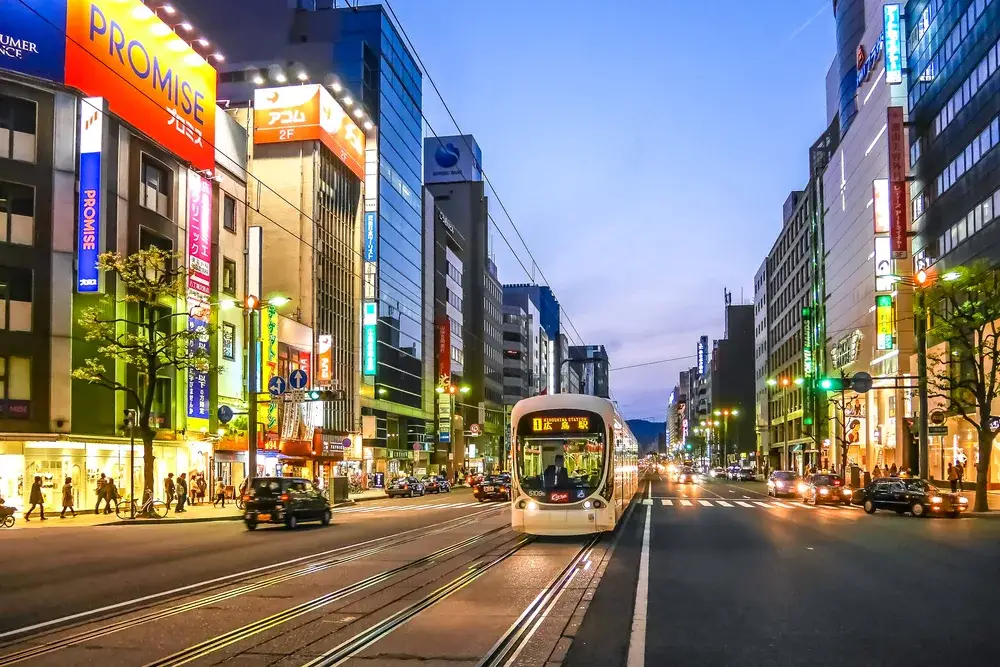 Electric Railway station in Hiroshima as seen at night with lights everywhere and clean roads