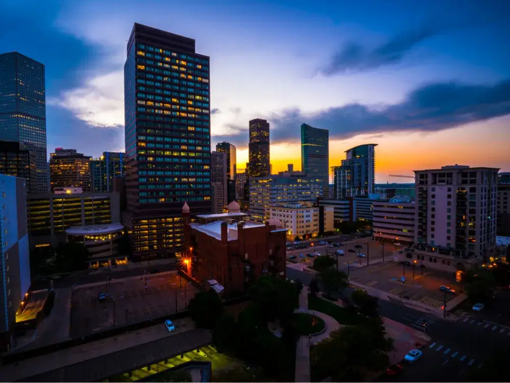 Denver city skyline at night for a piece on whether or not Denver is safe to visit