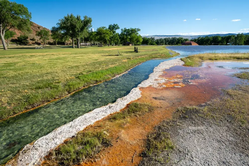 Mineral deposits on the edge of the water at the Hot Springs State Park in Wyoming, one of the best places to visit in the state