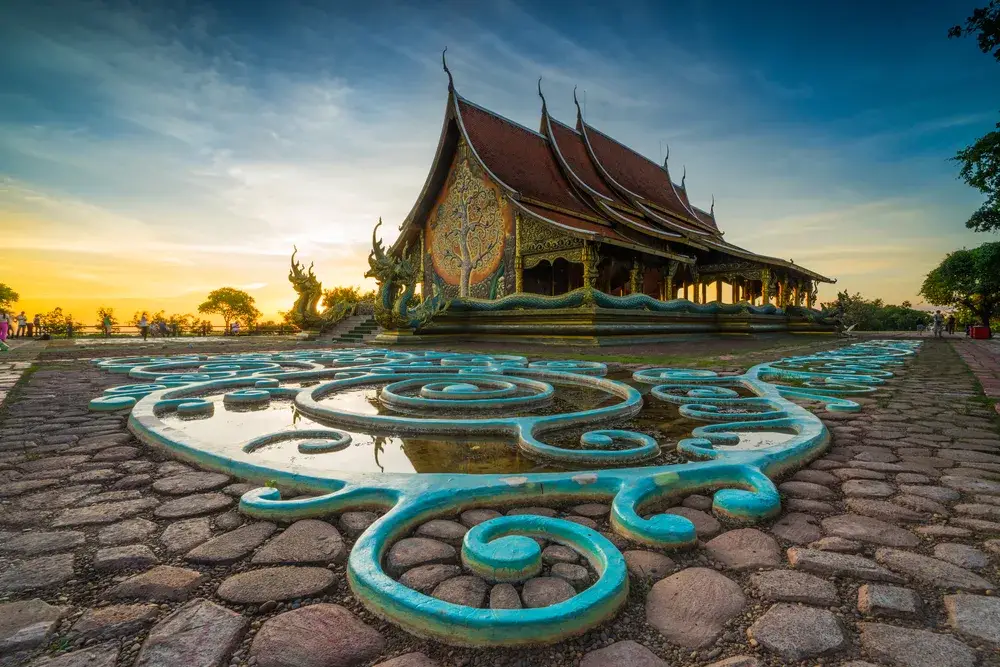 Wavy and glowing temple pictured at dusk, as seen at the Sirinthornwararam Phu Prao temple