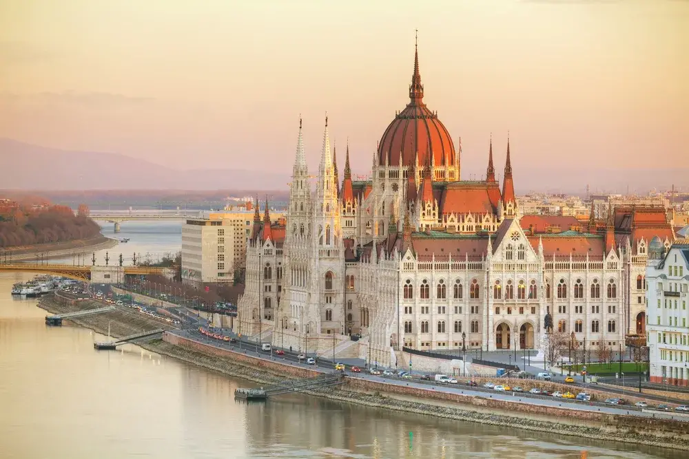 View of the Parliament building in Budapest at sunrise for a piece on Is Hungary Safe