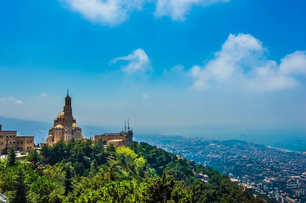 Aerial view of the Harissa Church overlooking the coast in Beirut during the overall best time to visit Lebanon for warm season travelers