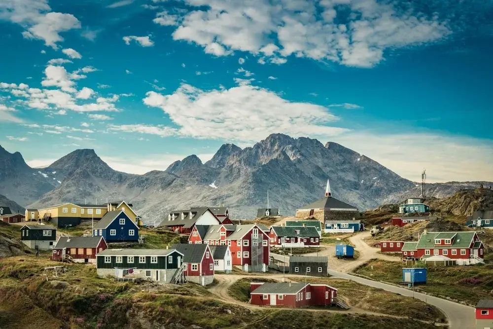 Neat and quaint little town in Greenland pictured during the best time to visit without snow on the ground