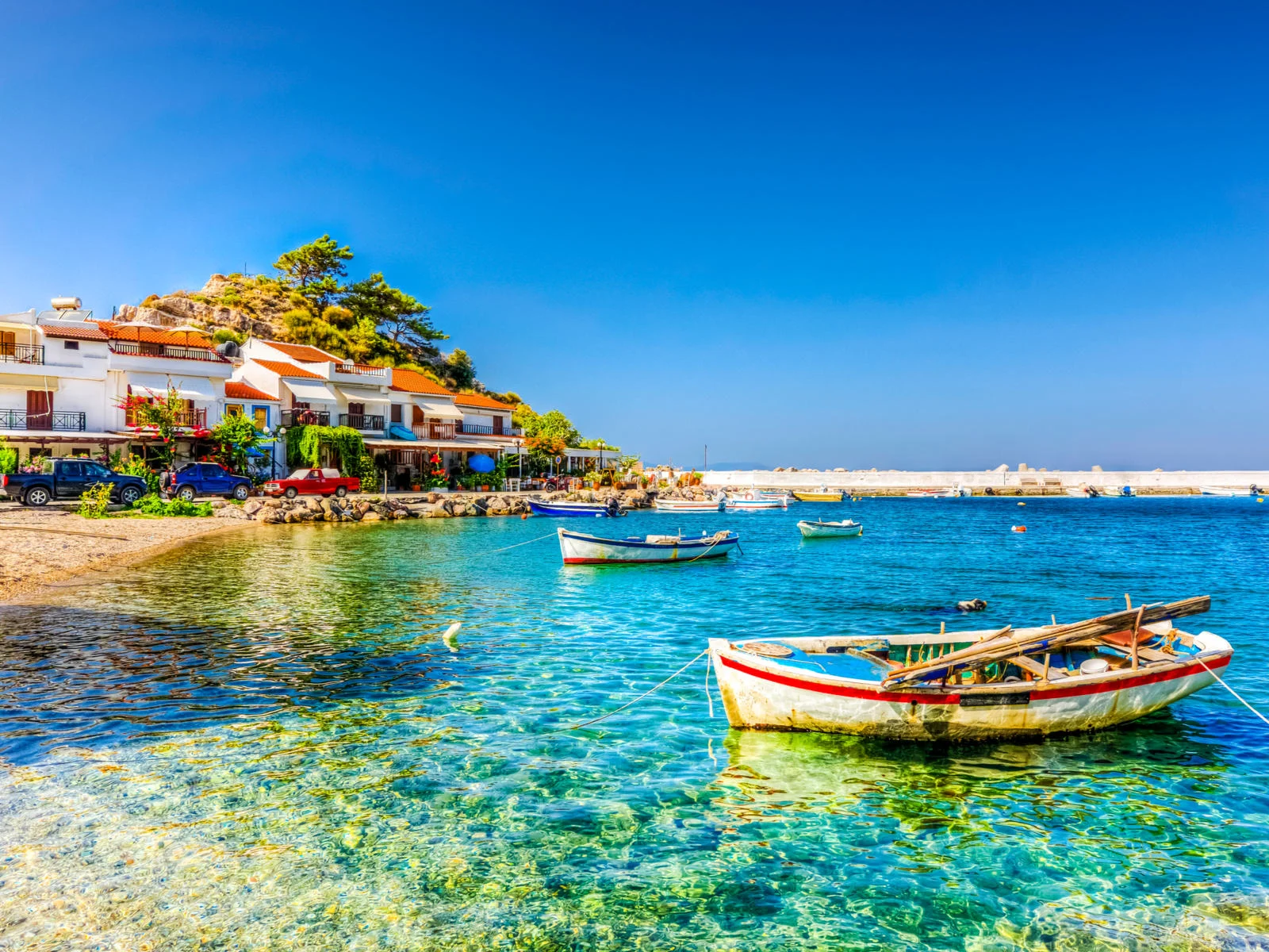 Rustic boats floating in Kokkari, one of the best islands in Greece