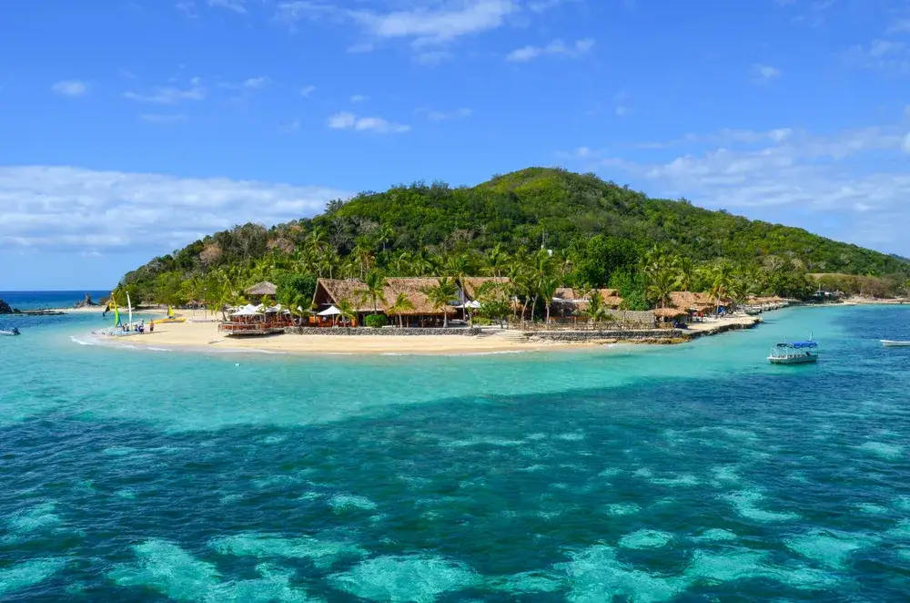 Castaway Island in Fiji pictured from the ocean looking toward the island