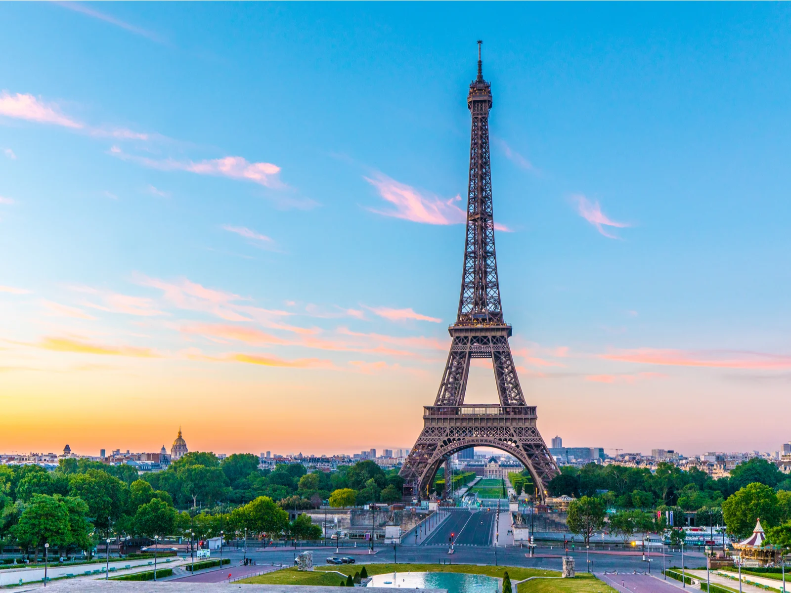 Eiffel tower at sunrise with the River Seine pictured in the background for a piece on the best time to visit Paris