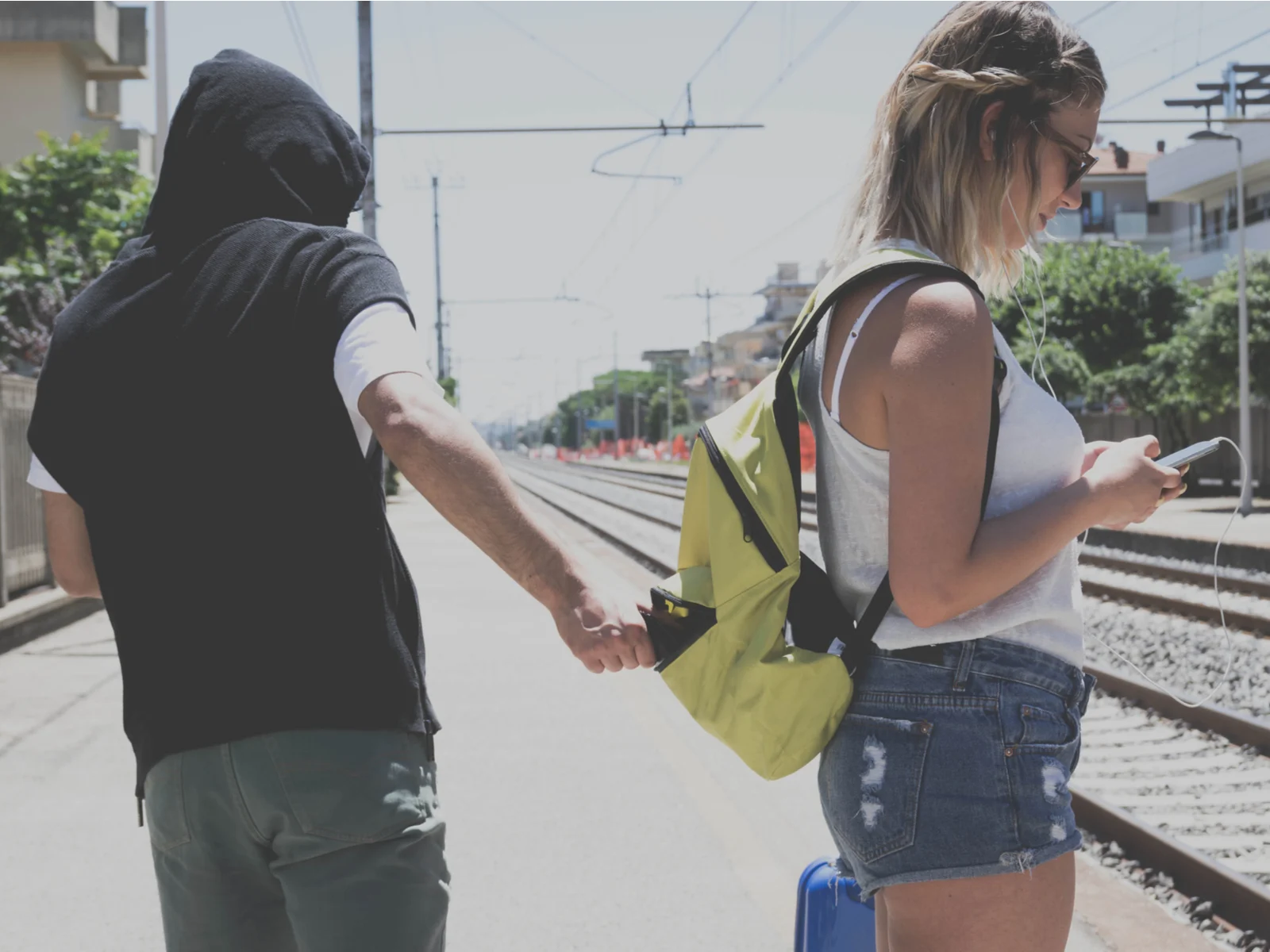 Image of a pickpocket pulling the wallet from a backpack for a piece on whether Mexico is safe or not