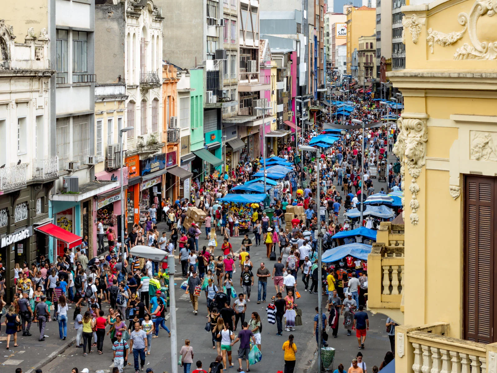 A bunch of people in a market in Sao Paulo during the best time to visit Brazil