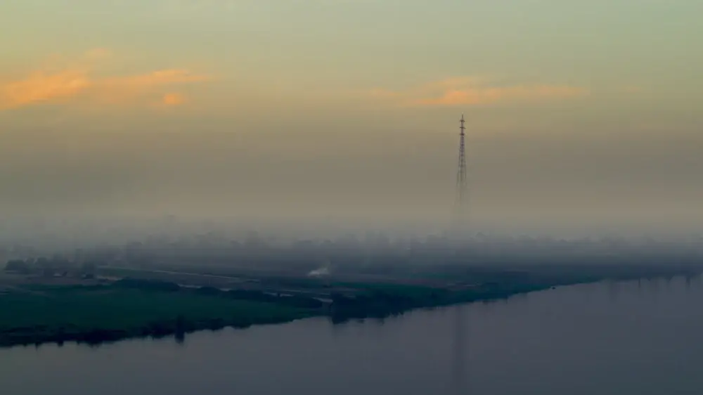 Foggy and hazy day with a giant tower in the background for a piece on the worst time to visit Cairo