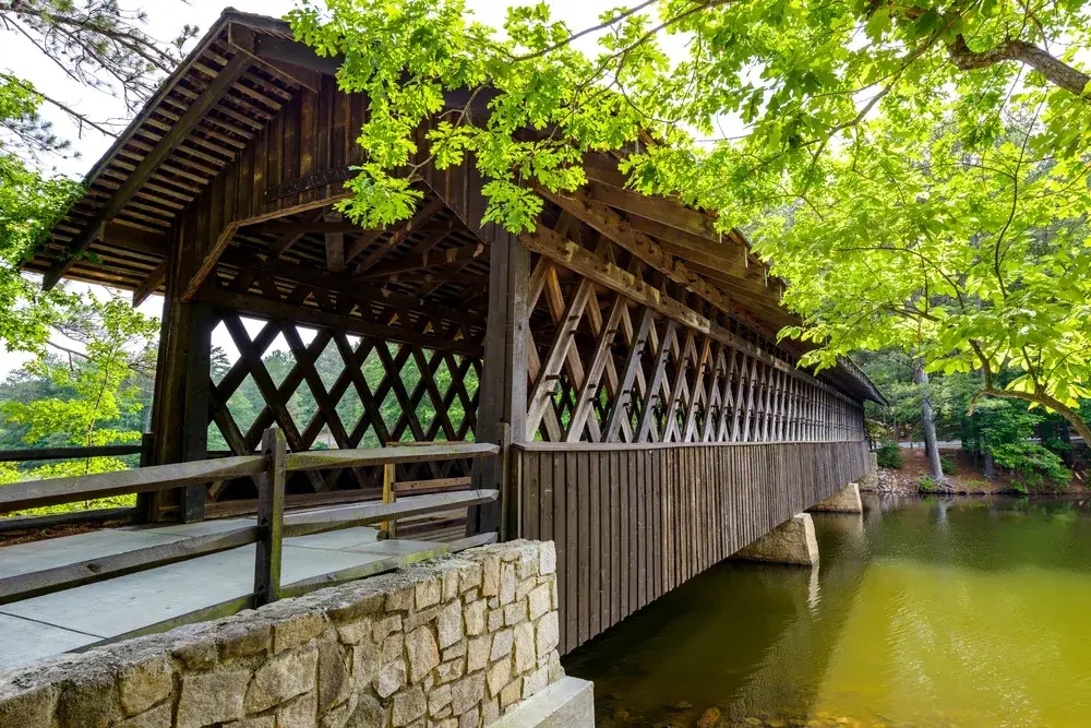 Neat view of a covered wooden bridge in Stone Mountain State Park 