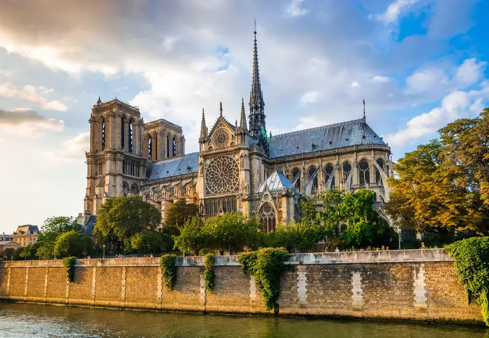 View of Notre Dame cathedral at sunset for a piece on Is Paris Safe