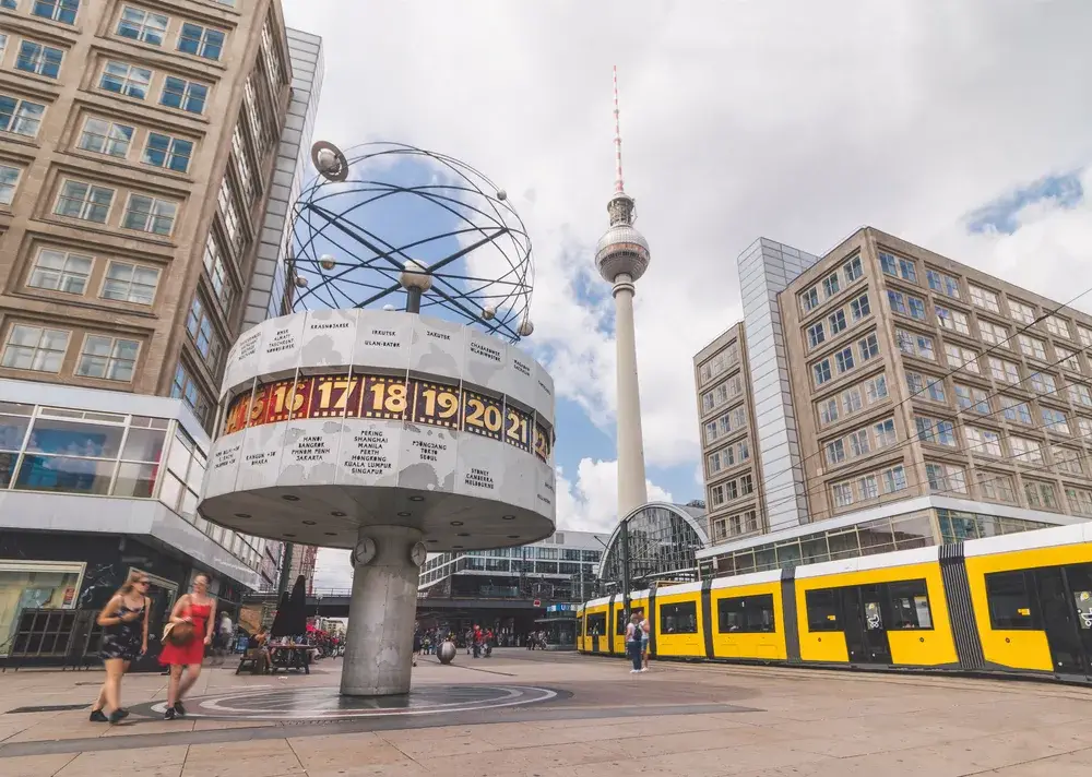 Old clock in the city center of Alexanderplatz, Berlin, one of the places to avoid in Germany