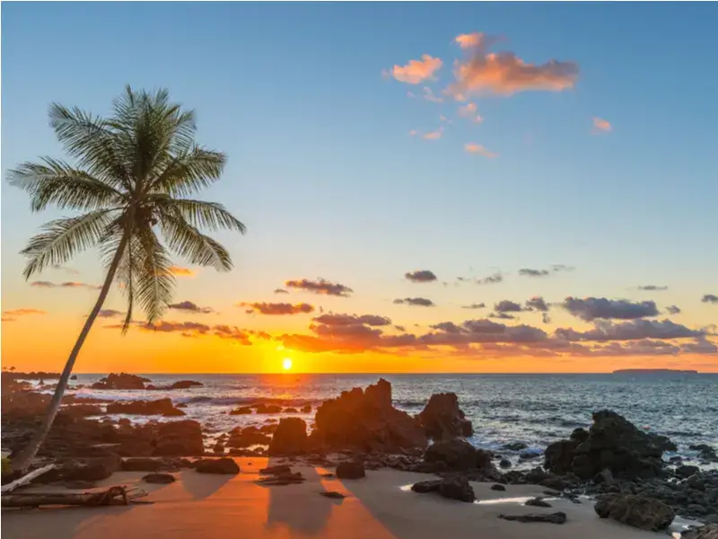 The least busy time to visit Costa Rica showing an empty beach at sunset