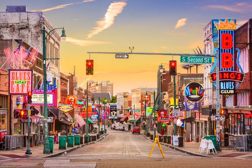 To show whether or not Memphis is safe to visit, a bunch of clubs pictured with a blocked off street at dawn