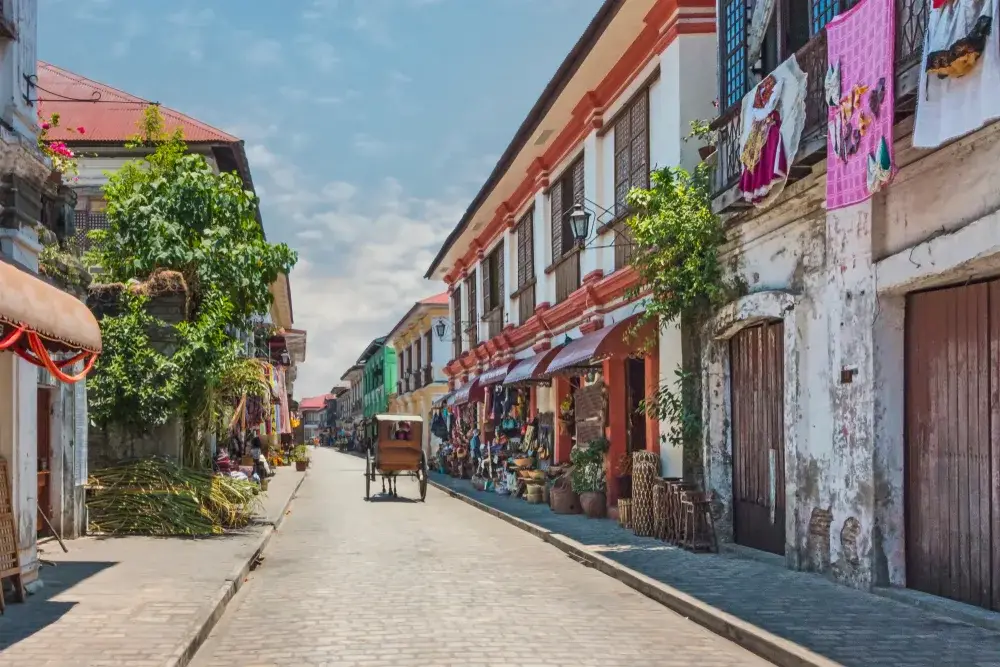 Horse-drawn carriage making its way through the streets in Vigan, Luzon, during the least busy time to visit the Philippines