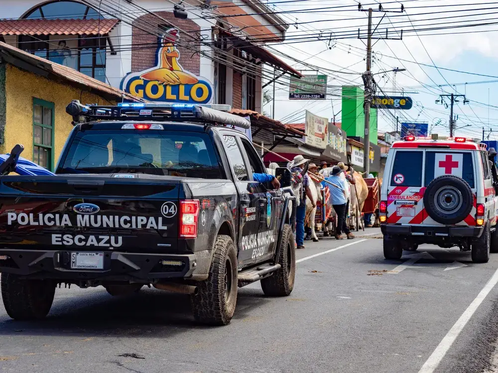 To illustrate that Costa Rica is very safe to visit, heavy police presence follows a parade in Escazu