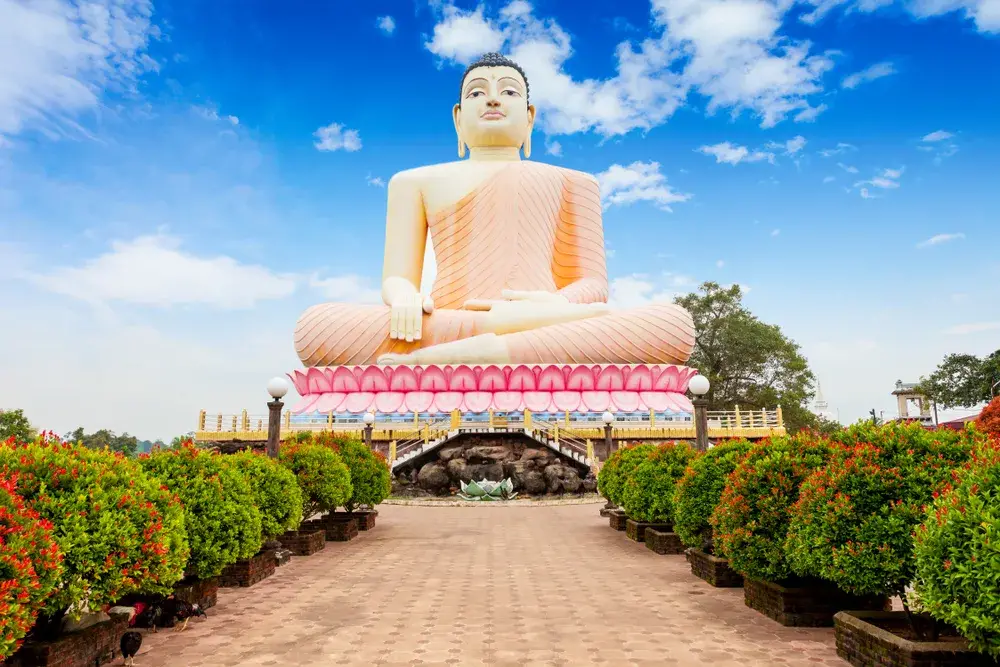 Giant buddha statue at Kande Vihara Temple during the least busy time to visit Sri Lanka