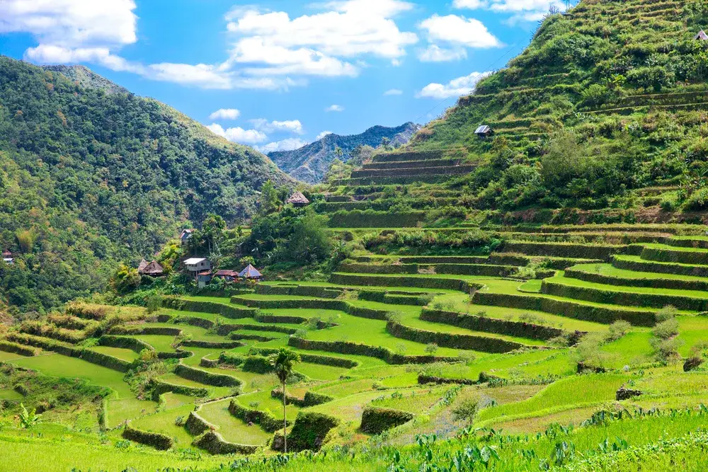 Morning light pouring in over the rice paddies of Batad for a piece on Are the Philippines Safe to Visit