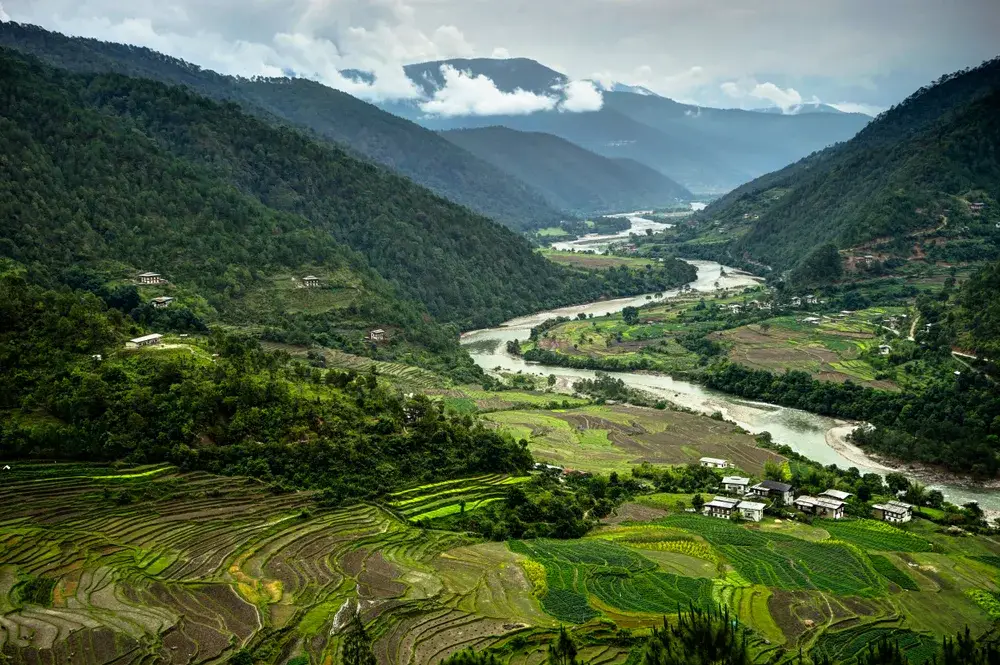 Vista view of mountains and valleys in Mantra during the cheapest time to visit Bhutan