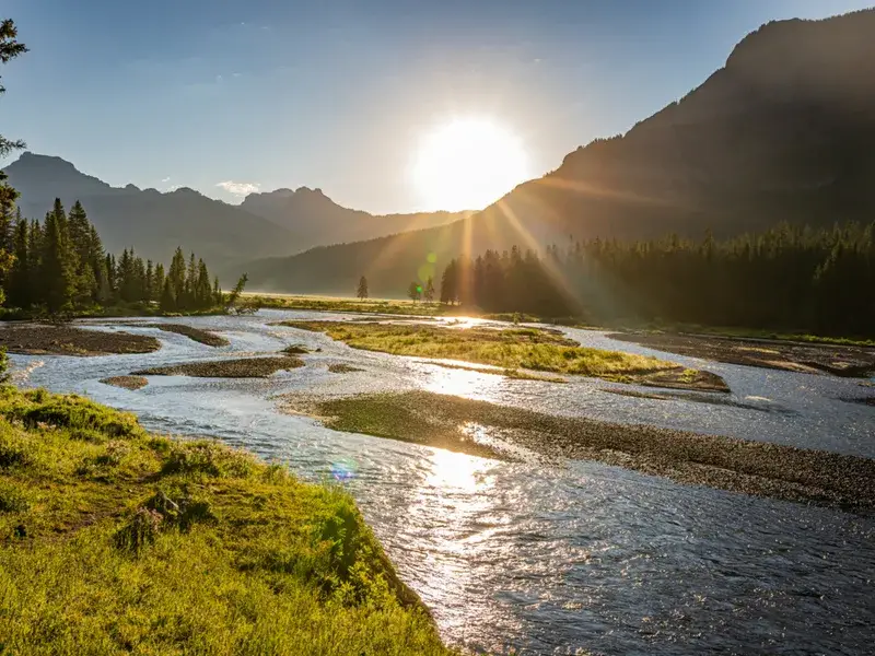 Sun rising over the Lamar Valley during the best time to go to Yellowstone, in late spring and early summer