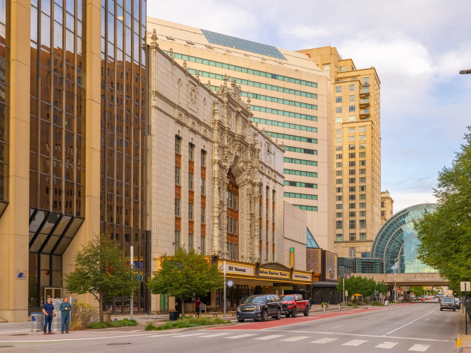 For a piece on whether or not Indianapolis is safe to visit, a theatre and skyline with a walkway is pictured