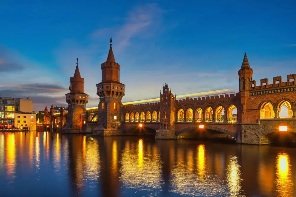 Oberbaum Bridge lit up at night during the least busy time to visit Berlin