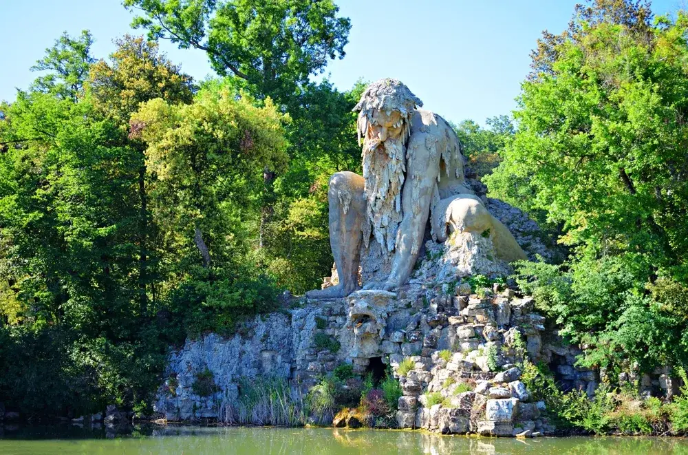 Stone sculpture, the Colossus of the Apennines, seen in Florence surrounded by greenery during the overall best time to visit Florence from April to June