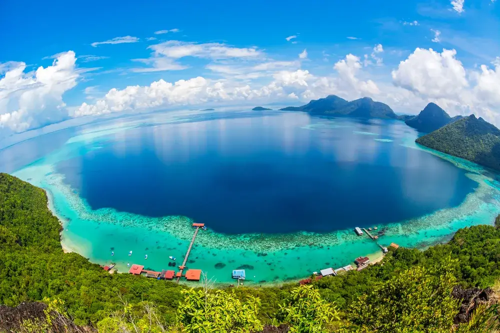 Aerial view of waters around Sabah Borneo in Tun Sakaran Marine Park island during the best time to visit Malaysia